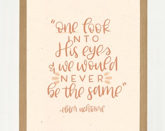 May include: A framed print with a light beige background and a quote in coral-colored script. The quote reads, "one look into His eyes & we would NEVER be the same" and is attributed to Elder Uchtdorf.