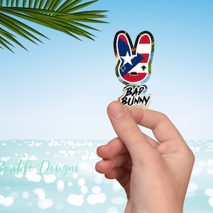 May include: A sticker featuring a cartoon bunny with a Puerto Rican flag design and the text "Bad Bunny".
