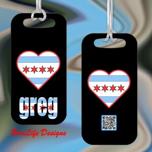 May include: Two black luggage tags with a red heart featuring the Chicago flag. The tag on the left has the name "greg" in red letters with white stars. The tag on the right has a QR code. Both tags have a white "BondLife Designs" logo.
