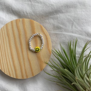 Yellow happy face pearl ring