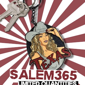 May include: A keychain featuring a woman wearing a cowboy hat with the word "TEXAS" in red. The keychain is attached to a key ring with keys. The background has a red and white striped pattern. The text "SALEM365 LIMITED QUANTITIES" is at the bottom.