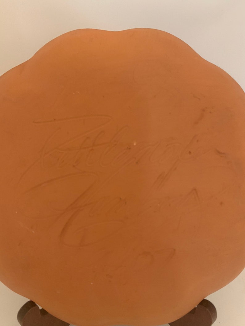 Signed pottery plate glazed bird beautiful