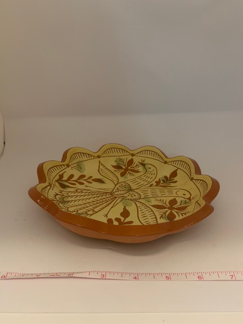 Signed pottery plate glazed bird beautiful