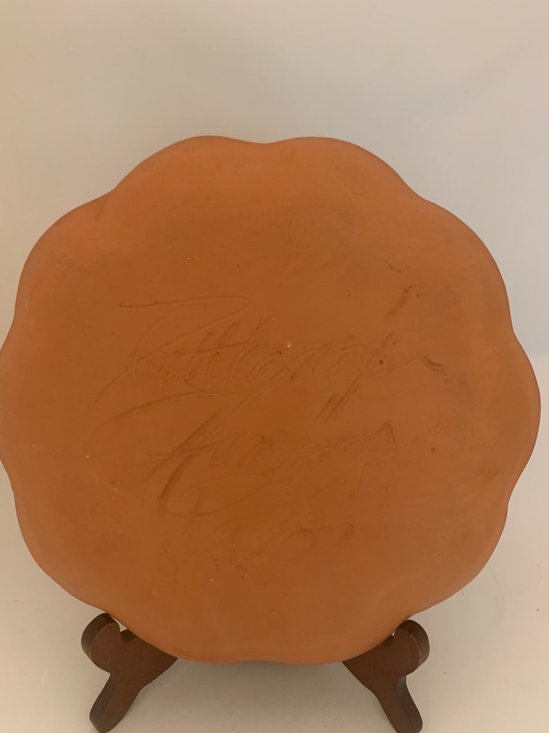Signed pottery plate glazed bird beautiful