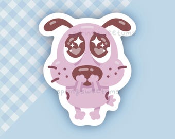Peut inclure: Un autocollant découpé représentant un chien de dessin animé violet clair avec de grands yeux marron foncé contenant des reflets blancs en forme d'étoile. Le chien a un nez marron foncé, des oreilles tombantes et de petites pattes.