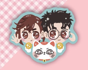 May include: A cartoon illustration of a couple with a white cat with a red spot on its forehead. The couple is holding gold coins and the cat is wearing a white collar with a bell. The background is a pink and white checkered pattern.
