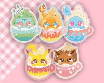 May include: Six colorful cartoon Pokemon characters are depicted in a cup of coffee or tea. Each character is in a different color cup with a different colored drink. The characters are Bulbasaur, Charmander, Squirtle, Pikachu, Eevee, and  a brown Pokemon with a pink cup.