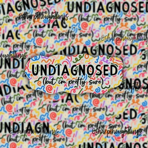 May include: A sticker with a colorful abstract design and the text "UNDIAGNOSED (but I'm pretty sure)".