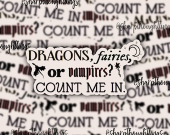 May include: White sticker with black text that reads "DRAGONS, fairies, or vampires? COUNT ME IN."  The sticker has a small black dragon illustration and a star and crescent moon.
