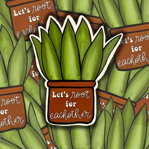 May include: A sticker featuring a potted plant with the text "Let's root for eachother". The plant is green and the pot is brown. The sticker is white with a white outline.