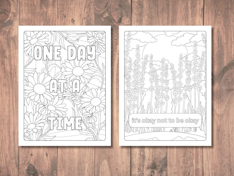 May include: Two black and white coloring pages. The first page features a floral design with the text "One Day At A Time". The second page features a field of lavender with the text "It's okay not to be okay".