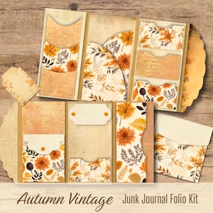 Op de afbeelding: Een open herfst-thema junk journal folio kit met zakken en decoratieve elementen. De kit heeft een vintage design met bloempatronen in tinten oranje, bruin en crème. De tekst "Autumn Vintage Junk Journal Folio Kit" is zichtbaar.