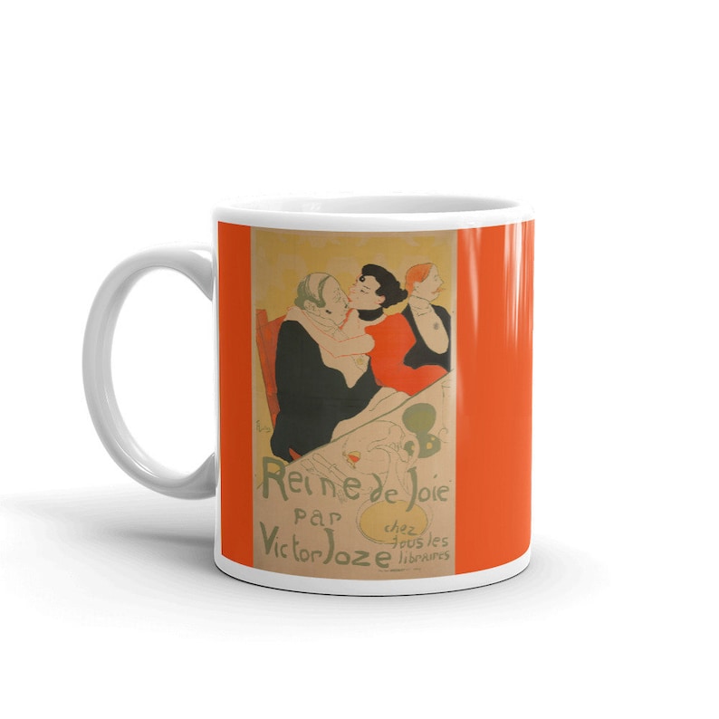 May include: White ceramic mug with a colorful image of three people. The image is a vintage poster for a play called "Reine de Joie" by Victor Joze. The text on the poster reads "chez tous les libraires".
