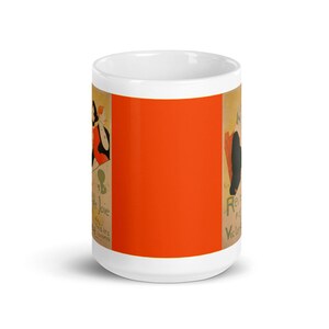 May include: White ceramic mug with a colorful vintage poster design featuring a woman in a red dress and the text "Revue de la Joie" and "Victor Larocque".