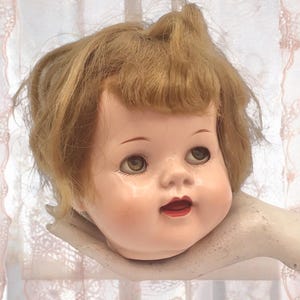 Vintage Distressed Plastic Doll Head: Creepy Halloween Prop