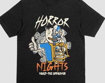 May include: Black t-shirt with a graphic design featuring a cartoon character with a skeleton and human side, giving a thumbs up. The words "HORROR NIGHTS" are above and below the character, with "VAULT-TEC APPROVED" below.