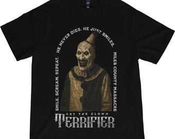 May include: Black t-shirt featuring a portrait of Art the Clown from Terrifier. The image includes the text "SMILE. SCREAM. REPEAT. HE NEVER DIES. HE JUST SMILES. MILES COUNTY MASSACRE" and "ART THE CLOWN TERRIFIER".