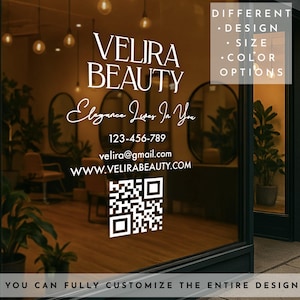 May include: A storefront window displays the text "VELIRA BEAUTY" with contact information and a QR code. The window also includes the phrase "Elegance Lives In You" and lists design, size, and color options. The bottom of the window reads "YOU CAN FULLY CUSTOMIZE THE ENTIRE DESIGN."