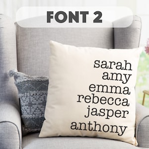 May include: A white pillow with the names "sarah", "amy", "emma", "rebecca", "jasper", and "anthony" printed in black.