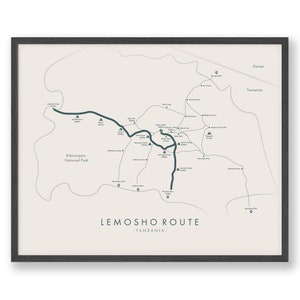 May include: Framed map print of the Lemosho Route in Tanzania, part of Kilimanjaro National Park. The map shows a teal route with labeled campsites and landmarks, on a cream background. The frame is dark grey.