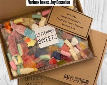 May include: A cardboard box filled with assorted colorful gummy candies in a clear plastic bag. The bag features a white label reading LETTERBOX SWEETZ and a brown gift tag with the text To Gabby, Happy 30th Birthday, I hope you have a fab one, Love Mich xx.