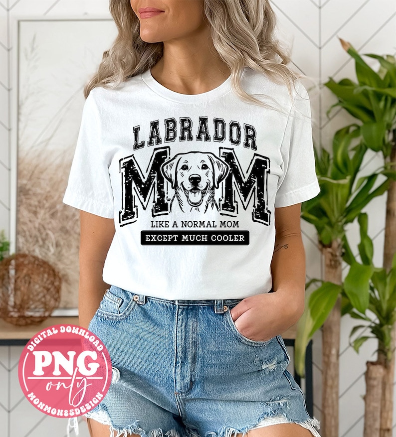 May include: White t-shirt with black text that reads "Labrador Mom Like a Normal Mom Except Much Cooler". A black and white illustration of a Labrador Retriever is in the centre of the text.
