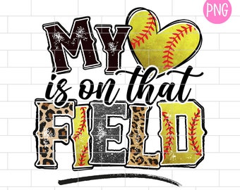 May include: A graphic design with the text "My heart is on that field" in black with a distressed look. The word "field" is made up of three softball images with red stitching and a leopard print pattern. A yellow softball with red stitching in the shape of a heart is above the text.