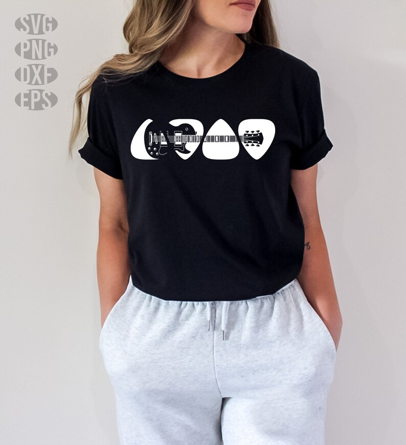 May include: A black t-shirt with a white graphic of a guitar inside of three guitar picks.