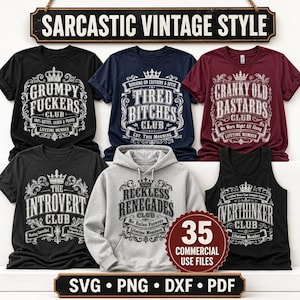 May include: A collection of apparel including t-shirts, a hoodie, and a tank top featuring white graphic prints with crowns and text such as Grumpy Fuckers Club, Tired Bitches Club, Cranky Old Bastards Club, The Introvert Club, and Reckless Renegades Club.