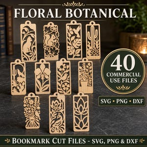 May include: A collection of eleven rectangular wooden bookmarks featuring intricate laser-cut designs of cats, squirrels, birds, cacti, and floral patterns. The text reads FLORAL BOTANICAL, 40 COMMERCIAL USE FILES, and SVG PNG DXF.