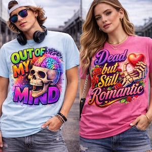 May include: Two short-sleeved t-shirts. One is light blue with the text "OUT OF MY MIND" and a skull graphic with a colorful brain. The other is pink with the text "Dead but Still Romantic" and a heart graphic.
