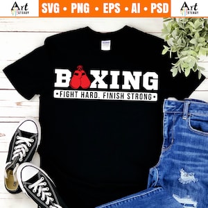 May include: Black t-shirt with white text that says "BOXING" and "FIGHT HARD. FINISH STRONG."  A pair of red boxing gloves are hanging from the word "BOXING".