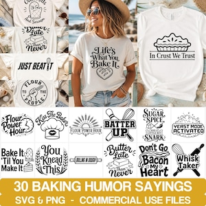 May include: A collection of white t-shirts featuring various black graphic designs with baking-themed humor and phrases like Life's What You Bake It, In Crust We Trust, Flour Power Hour, Batter Up, Yeast Mode Activated, and Whisk Taker.