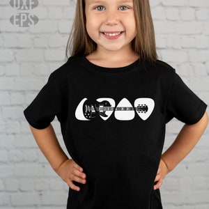 May include: A black t-shirt with a white graphic of a guitar made out of guitar picks.