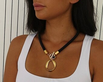 Black and gold necklace, Sculptured gold pendant