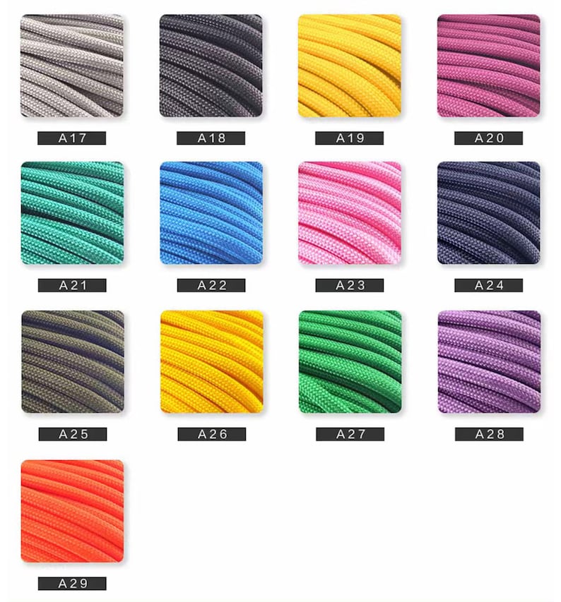 May include: A collection of thirteen square swatches displaying braided cord in various colors, labeled A17 through A29. The colors include gray, black, yellow, magenta, teal, blue, pink, dark blue, olive, gold, green, purple, and bright orange.