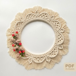 May include: A beige macrame wreath with a fringe border and a small sprig of red berries. The wreath is round and has a delicate pattern. The text "PDF 75 PAGES" is in the lower right corner of the image.