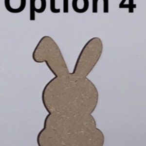 May include: Option 4: A wooden cutout of a rabbit, with a simple design. The rabbit is standing upright with its ears pointing up.