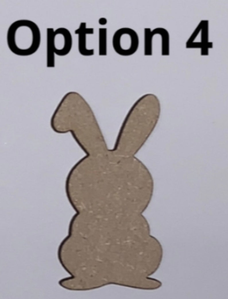 May include: Option 4: A wooden cutout of a rabbit, with a simple design. The rabbit is standing upright with its ears pointing up.