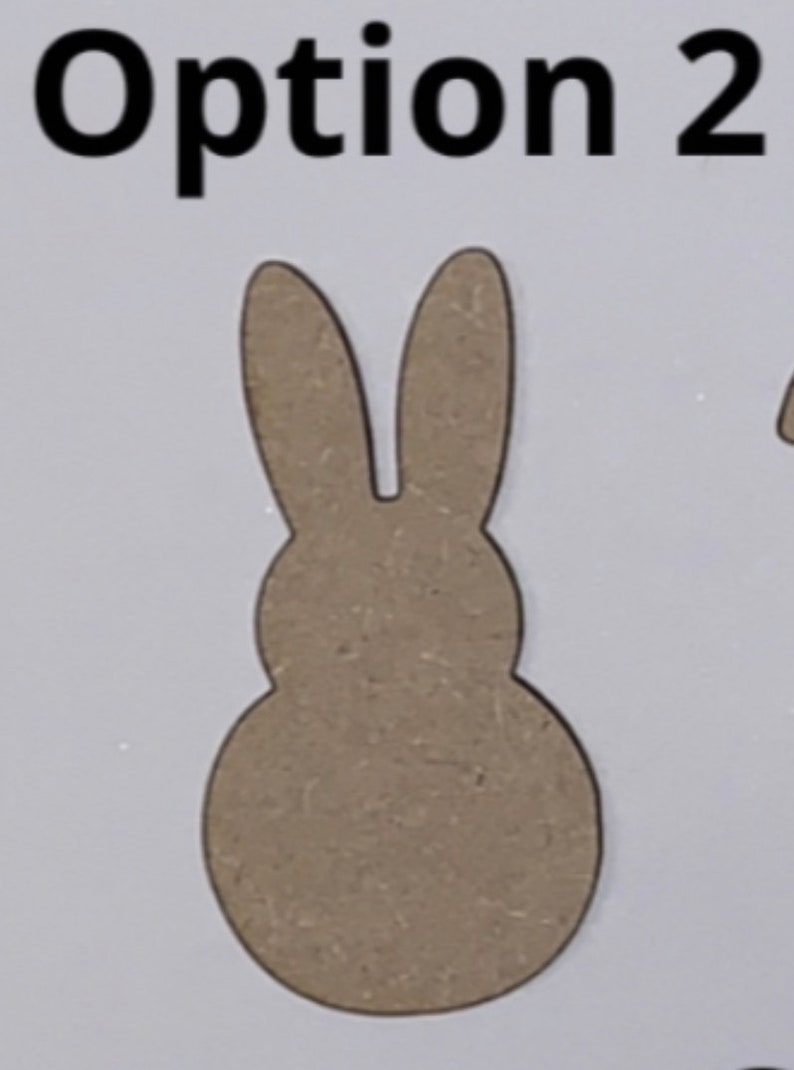 May include: A brown wooden cutout of a bunny rabbit with long ears. The cutout is shaped like a traditional Easter bunny.