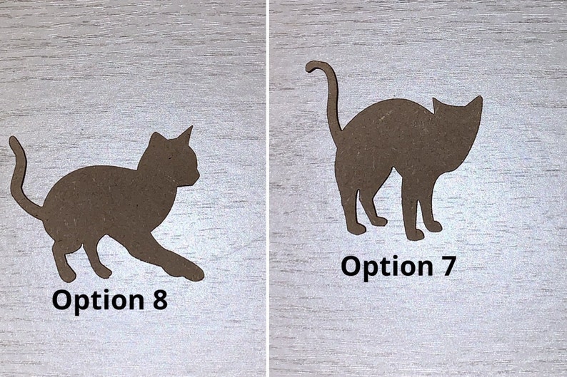 May include: Two brown cat silhouettes, labelled "Option 8" and "Option 7". Option 8 shows a cat in a playful pose, while Option 7 depicts a standing cat. The cat shapes are cut from a light brown material.
