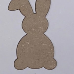 May include: A brown wooden cutout of a bunny rabbit. The bunny is sitting with its ears up. The cutout is labeled "Option 3".