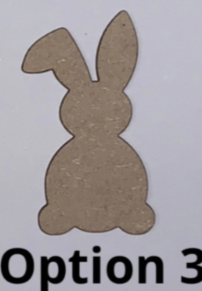 May include: A brown wooden cutout of a bunny rabbit. The bunny is sitting with its ears up. The cutout is labeled "Option 3".