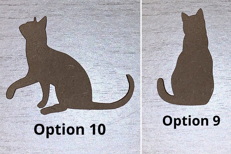 May include: Two brown cat silhouettes are shown on a light wood-grain background. One cat is sitting, the other has a paw raised. The text "Option 10" and "Option 9" are below each cat. These are likely decorative items for the home.