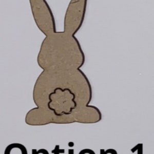 May include: A brown wooden cutout of a rabbit with a flower-shaped cutout on its backside. The cutout is labeled "Option 1".