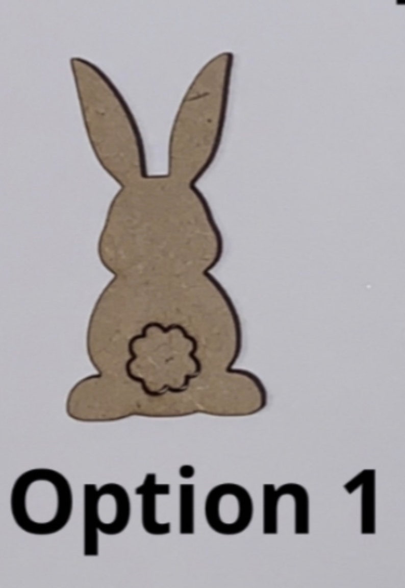 May include: A brown wooden cutout of a rabbit with a flower-shaped cutout on its backside. The cutout is labeled "Option 1".