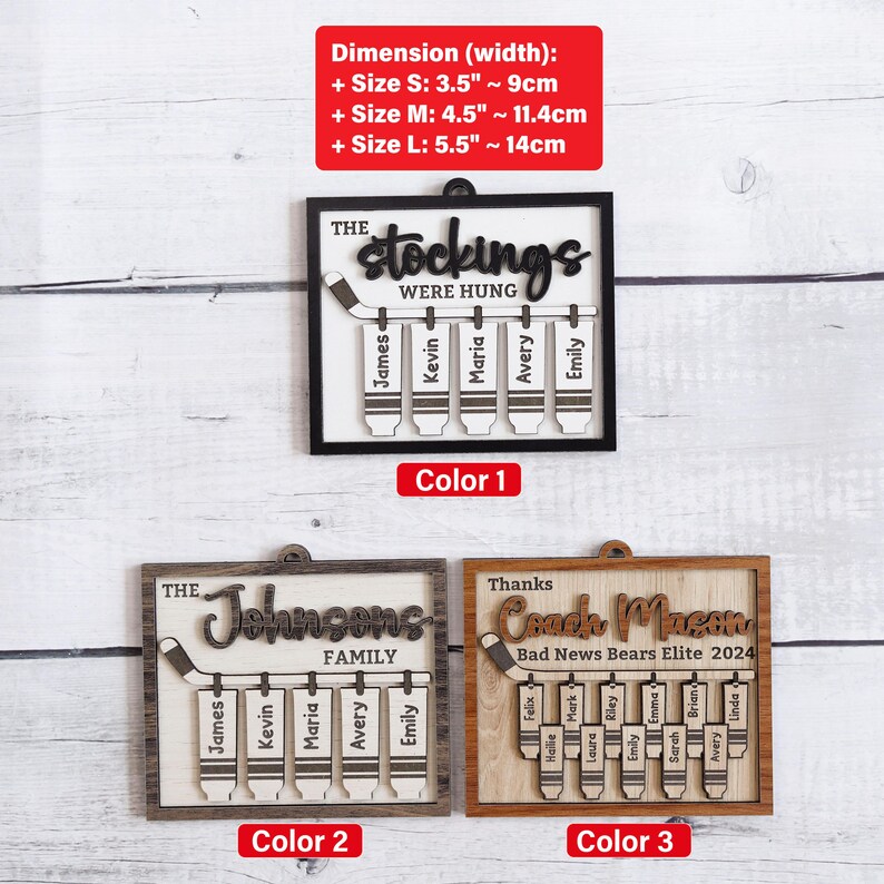 May include: Three wooden hockey stick ornaments with personalised names. The first ornament is black with white text and says "The Stockings Were Hung". The second ornament is brown with white text and says "The Johnsons Family". The third ornament is brown with white text and says "Thanks Coach Mason Bad News Bears Elite 2024".
