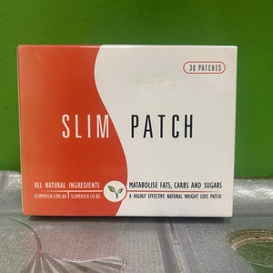May include: A box of Slim Patch weight loss patches. The box is white with a red curved design on the left side. Text on the box includes "Slim Patch", "30 patches", and "All Natural Ingredients".