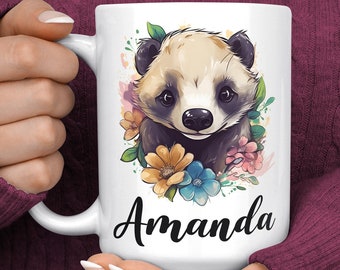 May include: White ceramic mug with a watercolor illustration of a cute cartoon badger with flowers. The mug has the name "Amanda" printed on the front.
