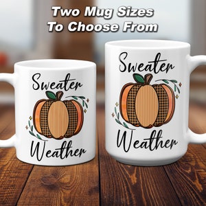 May include: Two white ceramic mugs with a pumpkin design and the text "Sweater Weather". The mugs are available in two sizes.